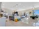 Bright kitchen boasting an island, stainless steel appliances, and sleek counter tops at 17300 Pesce Loop, Montverde, FL 34756