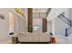 Elegant living room featuring a high ceiling, modern decor, and a view of the staircase at 17300 Pesce Loop, Montverde, FL 34756