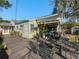 Spacious backyard deck featuring comfortable seating, potted plants, and a relaxing outdoor ambiance at 2107 University Dr, Orlando, FL 32804