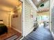 Hallway leading from bedroom to a covered patio with seating and decor at 2107 University Dr, Orlando, FL 32804