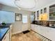 Functional kitchen with tiled floors, ample counter space, and a convenient back door for easy access to the outdoors at 2107 University Dr, Orlando, FL 32804
