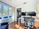 Bright home office with hardwood floors, two monitors, and a view to the outside from the window at 2107 University Dr, Orlando, FL 32804