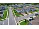 Aerial view of a neighborhood with well-maintained lawns, paved streets, and two-story houses at 2313 Ivy Harvest Pl, Oviedo, FL 32765