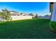 A spacious backyard surrounded by a white vinyl fence provides privacy at 2313 Ivy Harvest Pl, Oviedo, FL 32765
