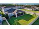 A well-manicured lawn and screened porch highlight this home's backyard at 2313 Ivy Harvest Pl, Oviedo, FL 32765