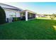 Manicured backyard with screened in porch and lush grass at 2313 Ivy Harvest Pl, Oviedo, FL 32765