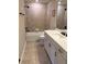 Bright bathroom with a tub-shower combination, white vanity, and modern fixtures at 2313 Ivy Harvest Pl, Oviedo, FL 32765