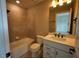 Well-lit bathroom featuring tub, toilet, vanity with granite countertop and tile flooring at 2313 Ivy Harvest Pl, Oviedo, FL 32765