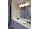 This primary bathroom has double sinks, white cabinets, and a large mirror at 2313 Ivy Harvest Pl, Oviedo, FL 32765