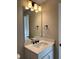 Bright bathroom with a white vanity, a speckled counter, and modern fixtures at 2313 Ivy Harvest Pl, Oviedo, FL 32765