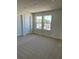 Bedroom includes 3 windows and neutral carpeting at 2313 Ivy Harvest Pl, Oviedo, FL 32765