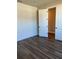 Modern bedroom featuring stylish flooring and a shiplap wall detail at 2313 Ivy Harvest Pl, Oviedo, FL 32765