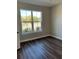 Clean and bright bedroom featuring sleek flooring and a large window at 2313 Ivy Harvest Pl, Oviedo, FL 32765