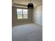 This bedroom features new carpet, large windows and a decorative wall at 2313 Ivy Harvest Pl, Oviedo, FL 32765