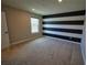 Cozy bedroom featuring neutral carpet, fresh paint, and a window providing natural light at 2313 Ivy Harvest Pl, Oviedo, FL 32765