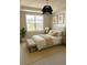 Comfortable bedroom with a plush bed, ample natural light, and stylish accents at 2313 Ivy Harvest Pl, Oviedo, FL 32765