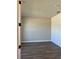 Bright bedroom showcasing modern flooring and shiplap accent wall at 2313 Ivy Harvest Pl, Oviedo, FL 32765