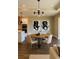 Cozy dining area featuring modern chandelier over a round table and stylish chairs at 2313 Ivy Harvest Pl, Oviedo, FL 32765
