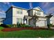 Inviting two-story home featuring manicured landscaping, a two-car garage, and a neutral color palette at 2313 Ivy Harvest Pl, Oviedo, FL 32765