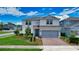 Charming two-story home with a two-car garage, brick paver driveway, and beautifully landscaped yard at 2313 Ivy Harvest Pl, Oviedo, FL 32765