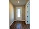 Well-lit foyer featuring a decorative glass front door and wood-look flooring at 2313 Ivy Harvest Pl, Oviedo, FL 32765