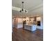 Spacious kitchen with center island, stainless steel appliances, and modern lighting at 2313 Ivy Harvest Pl, Oviedo, FL 32765