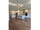 Bright, modern kitchen with stainless appliances, white cabinets, and center island with pendant lighting at 2313 Ivy Harvest Pl, Oviedo, FL 32765