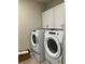 Laundry room featuring side-by-side washer and dryer, and white cabinets at 2313 Ivy Harvest Pl, Oviedo, FL 32765