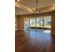 Open concept living room with sliders to outdoor living area and chandelier at 2313 Ivy Harvest Pl, Oviedo, FL 32765