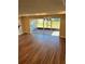 Open concept living room with sliders to outdoor living area and chandelier at 2313 Ivy Harvest Pl, Oviedo, FL 32765