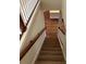 View of staircase leading to wood-look vinyl plank flooring landing at 2313 Ivy Harvest Pl, Oviedo, FL 32765