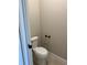 This bathroom has a white toilet, baseboards and neutral colored walls at 2313 Ivy Harvest Pl, Oviedo, FL 32765