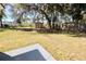 Spacious backyard enclosed with white and brown fencing offers ample room for outdoor activities at 2360 Justy Way, Orlando, FL 32817
