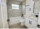 Updated bathroom featuring a bathtub, white vanity with marble countertop, and black fixtures at 2360 Justy Way, Orlando, FL 32817