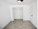 Bright bedroom with ceiling fan, tiled flooring, and closet for ample storage at 2360 Justy Way, Orlando, FL 32817