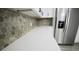 Kitchen features a white countertop, geometric backsplash, and stainless steel appliances at 2360 Justy Way, Orlando, FL 32817