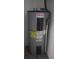 Close-up of installed Mor-Flo brand water heater at 2360 Justy Way, Orlando, FL 32817