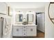 Bright bathroom with double sink vanity, modern fixtures, and ample storage at 2365 Eagle Trace Dr, Kissimmee, FL 34746