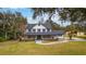 Lovely two-story home with a full front porch, well-manicured lawn, and welcoming curb appeal at 2365 Eagle Trace Dr, Kissimmee, FL 34746