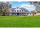 Charming two-story home with a sprawling lawn, welcoming front porch, and classic black shutters at 2365 Eagle Trace Dr, Kissimmee, FL 34746