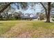 Stately two-story home with a sprawling front lawn, a covered front porch, and a convenient side-entry garage at 2365 Eagle Trace Dr, Kissimmee, FL 34746
