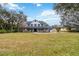 Beautiful two-story home with a spacious front yard, inviting porch, and traditional architectural details at 2365 Eagle Trace Dr, Kissimmee, FL 34746