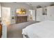 Spacious main bedroom with TV, walk-in closet, and neutral color palette at 2365 Eagle Trace Dr, Kissimmee, FL 34746