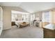Spacious main bedroom with large windows, sitting area, and neutral color palette at 2365 Eagle Trace Dr, Kissimmee, FL 34746