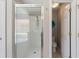 Bathroom showing glass enclosed shower, commode, storage closet and tile flooring at 248 Rosso Dr, Davenport, FL 33837