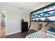 ' bedroom features a bunk bed and dark hardwood floors with neutral paint scheme at 248 Rosso Dr, Davenport, FL 33837