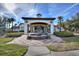 Beautiful clubhouse featuring a water fountain, clock tower, and welcoming entrance for residents and guests at 248 Rosso Dr, Davenport, FL 33837