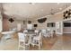 Spacious common area with tables, chairs, ceiling fans, and TVs for entertaining guests at 248 Rosso Dr, Davenport, FL 33837