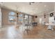 Large common area with tables, chairs, and expansive windows providing abundant natural light at 248 Rosso Dr, Davenport, FL 33837