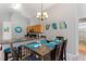 Dining room adjacent to kitchen with a modern chandelier at 248 Rosso Dr, Davenport, FL 33837